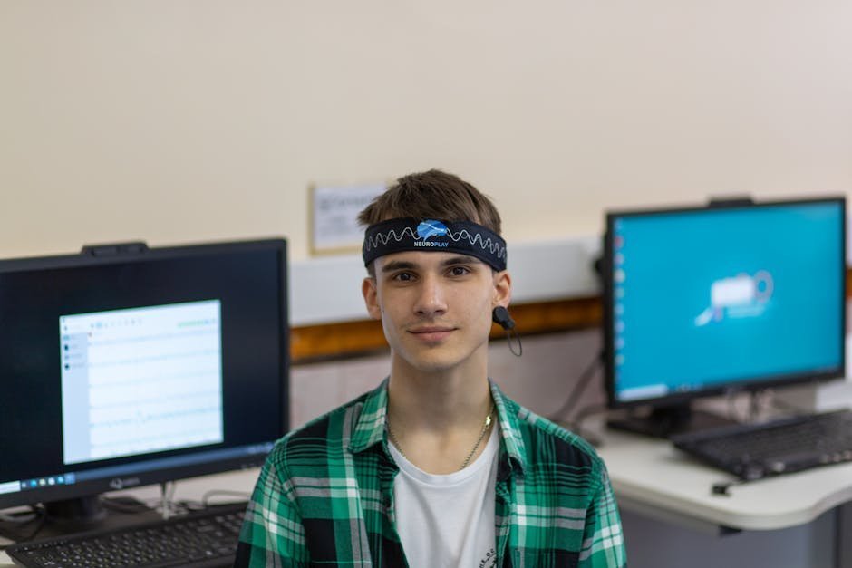 EEG tracing on hospital monitor with neurologist reviewing chart