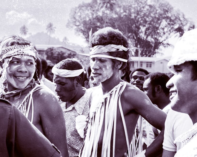 Two-Spirit Pride gathering with traditional regalia and rainbow flag
