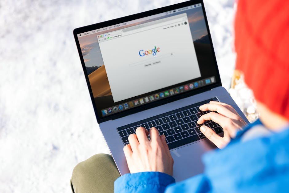 Person searching online directory of recovery community centers on laptop