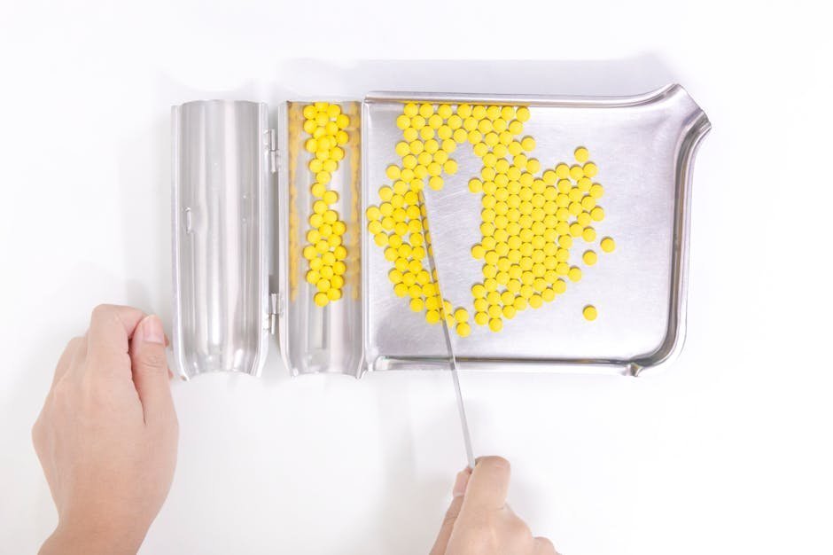 Pharmacist hands counting pills behind a pharmacy counter for medication consultation