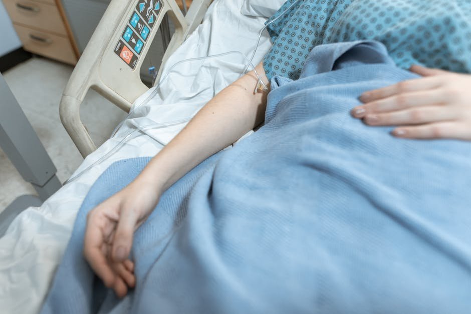 Cooling blanket and IV equipment ready for a hyperthermic stimulant patient in an ER bay