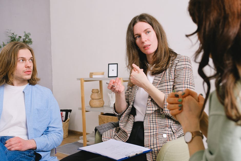 College student in a counseling office speaking with a campus mental health clinician