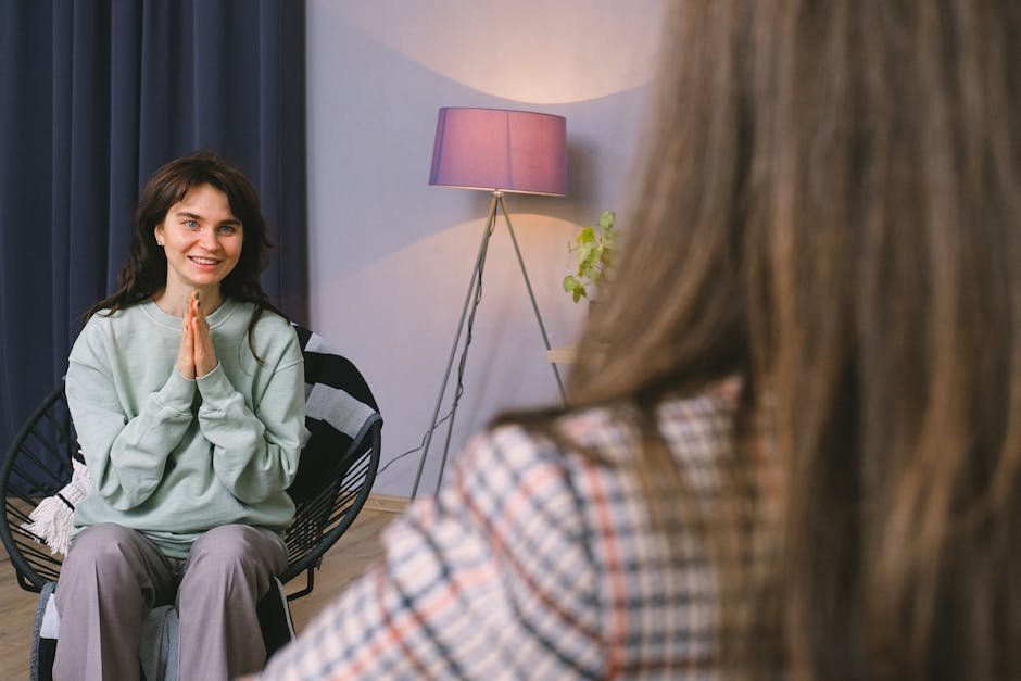 Addiction recovery counseling session with patient and clinician in a private treatment room