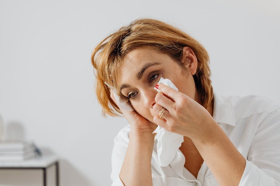 Therapist offering tissues to a tearful client during a pet loss counseling session