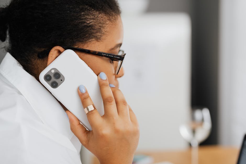 Person on phone advocating for insurance approval