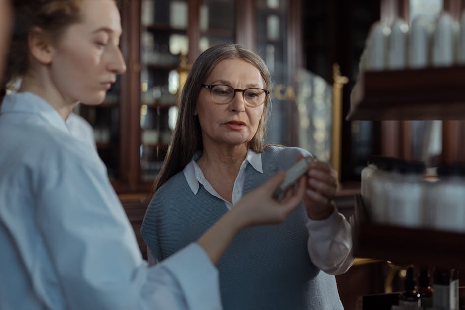 Pharmacist consulting with patient on monthly injectable medication schedule