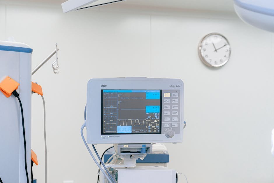 Hospital emergency room with monitor showing patient vital signs at night
