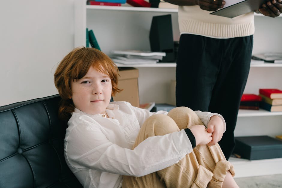 Family therapy session with trans youth and supportive parents discussing gender affirmation