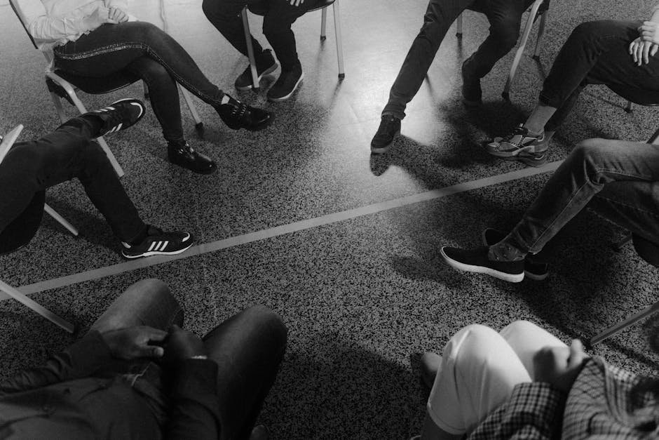 Students sitting in circle during morning meeting at recovery high school