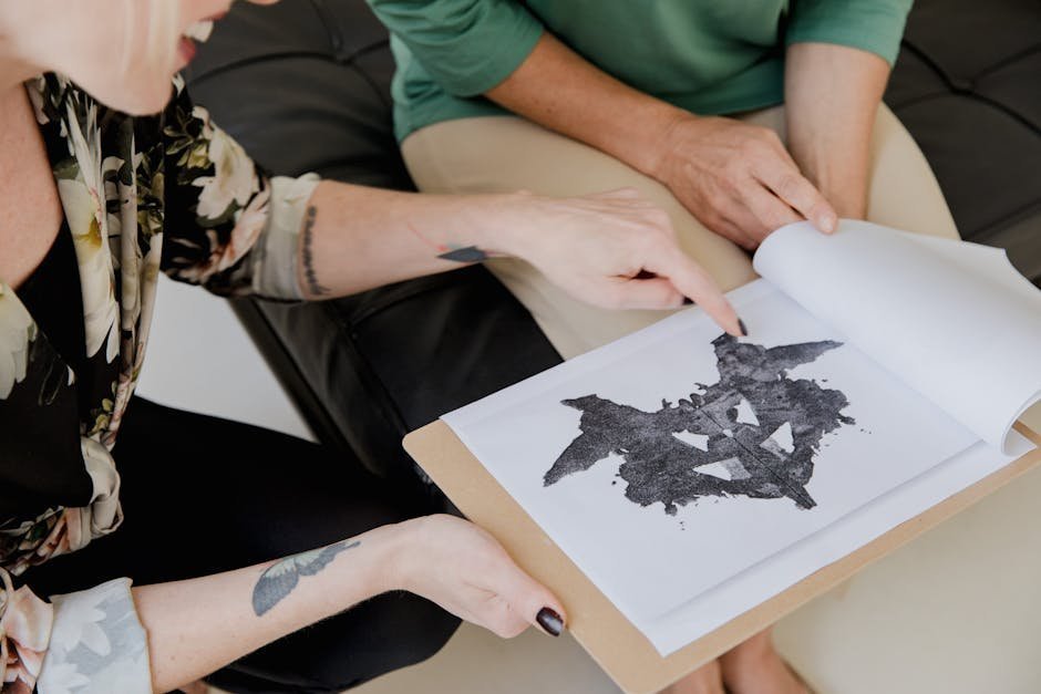 Neuropsychologist conducting cognitive assessment with concussion patient at rehabilitation center