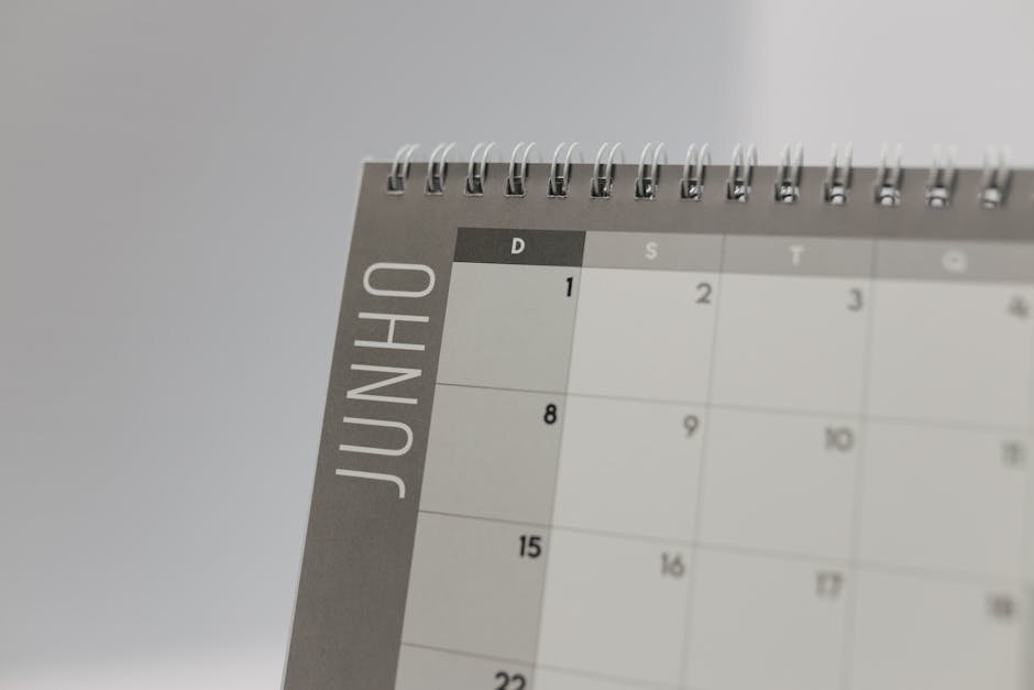 A calendar on a desk with a session appointment marked, a pen, and a folder labeled insurance documents, suggesting organized scheduling of therapy