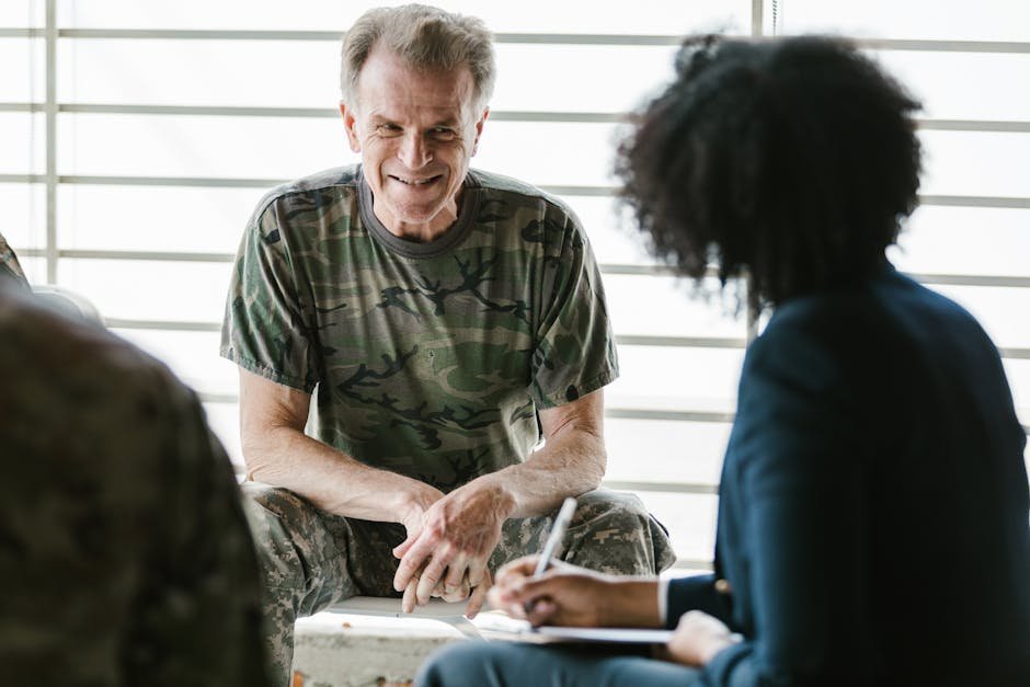 Substance use counselor conducting therapy session with client in outpatient treatment center office