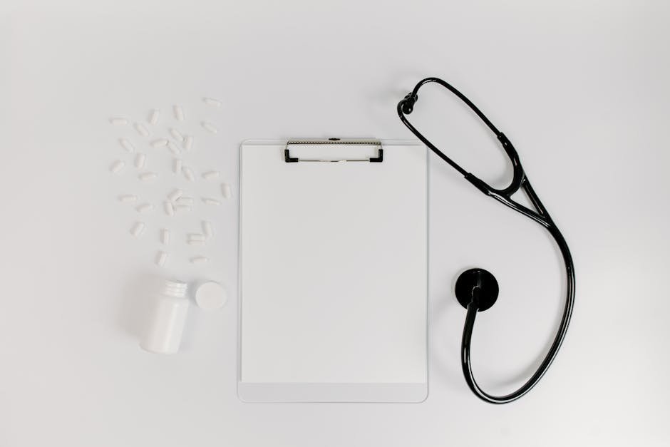 Pharmacy bottle and medication next to a stethoscope and patient education materials about SSRIs