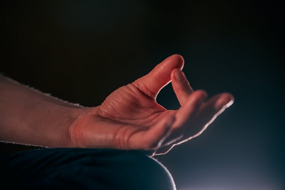Hands resting open and relaxed during meditation portion of class